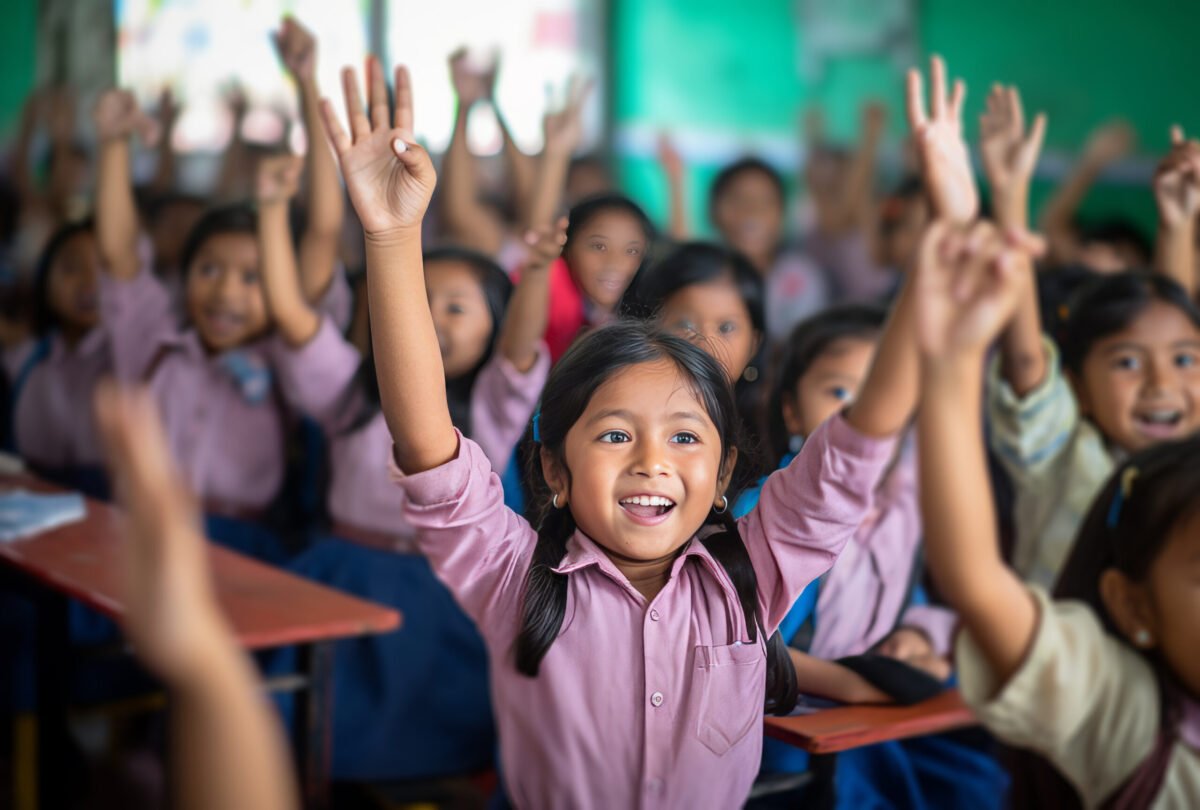 children are raising their hands in a classroom.